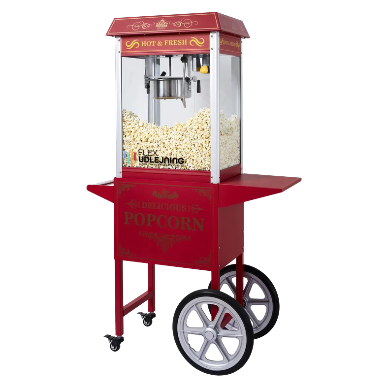 Klassisk rød popcornmaskine monteret på rød vogn med store hjul og sidehylder